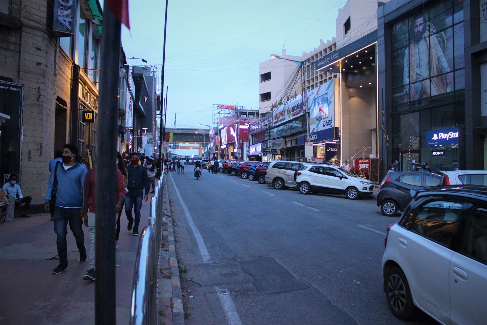 Shopfront signs along Brigade Road toward MG Road in Bengaluru, Karnataka